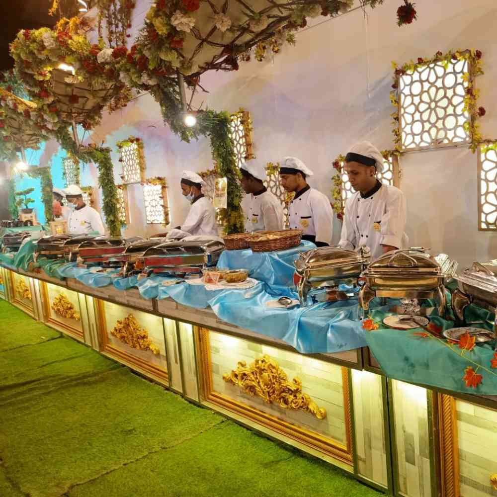 Beautiful buffet setup by gharoa catering staffs, we are maintaining hygiene wearing gloves, musk, caps, showcasing the best catering services in kolkata